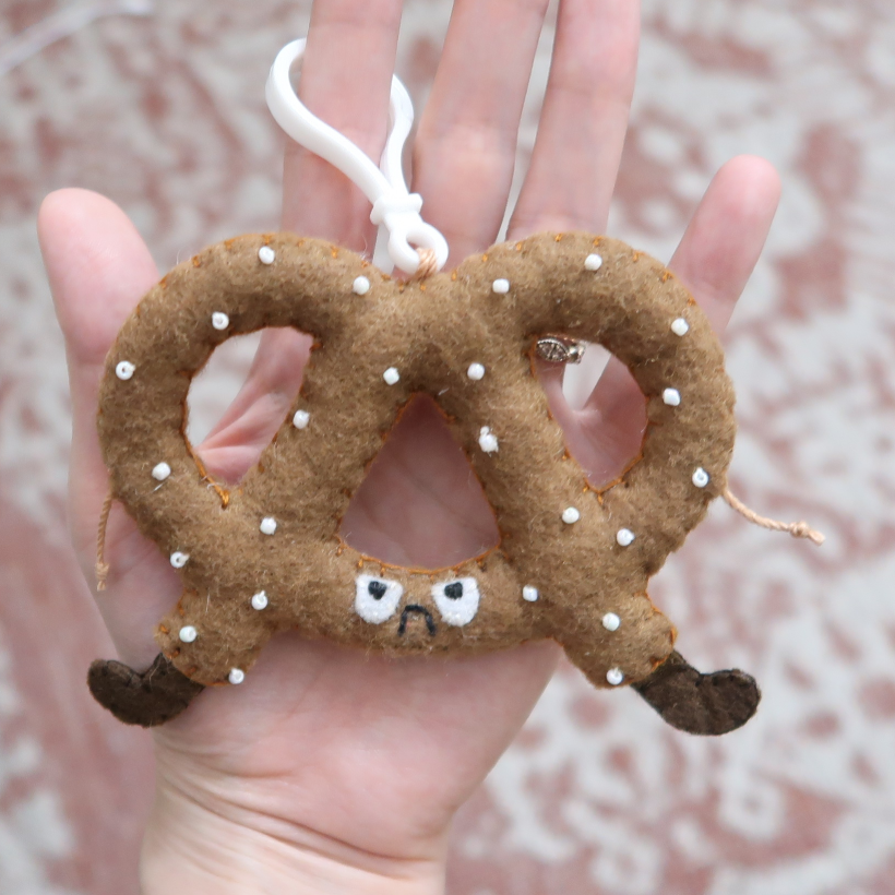 Pretzel Grumpy Guy Felt Bag Charm 🥨